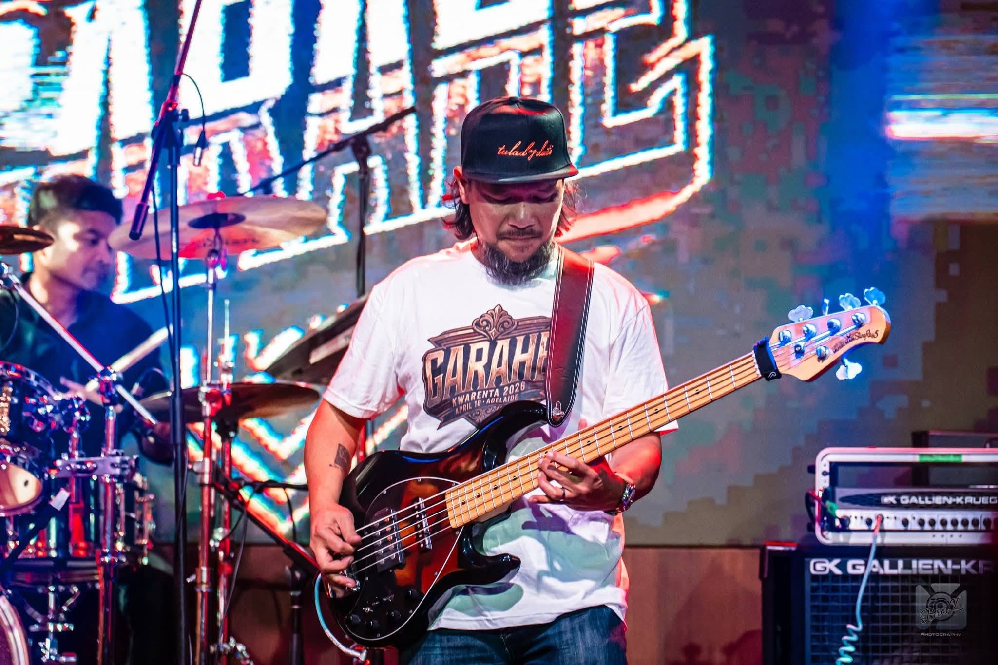 TeaKo fan playing bass on stage at GARAHE Kwarenta 2026, Adelaide